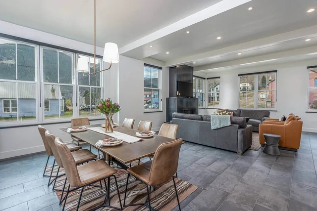 Open dining and living space with wall-to-wall mountain views
